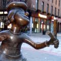 Statue to Minnie the Minx firing a catapult at Desperate Dan.